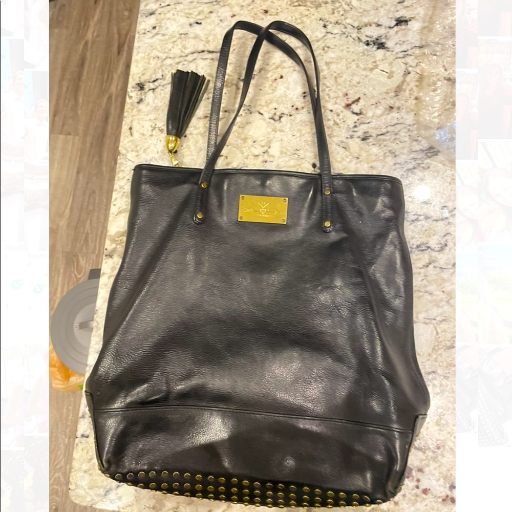 Rebecca Minkoff Black Tote with Studded detail and Tassel. Perfect for fall!!